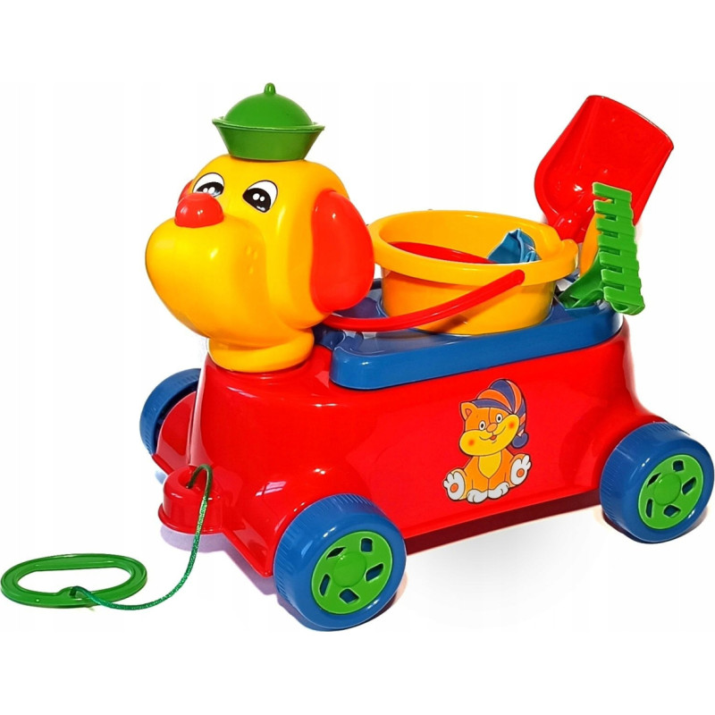 Šuniukas su smėlio žaislų rinkiniu